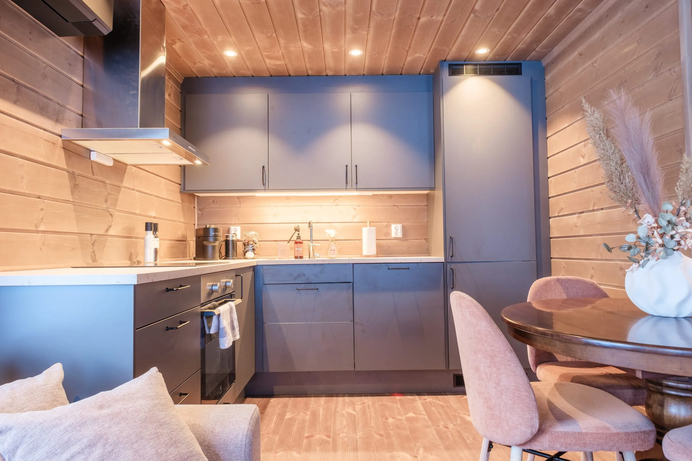 Modern kitchen with slate cabinetry, full appliances and a Nespresso machine